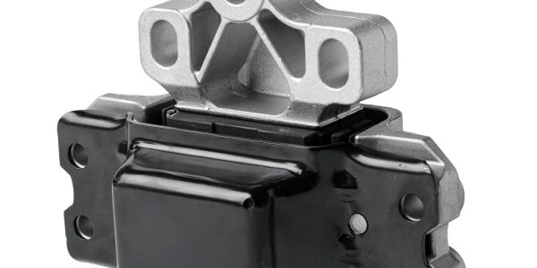 Close-up of a metallic and black automotive engine mount component.