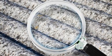 Magnified view of a textured surface with a magnifying glass.