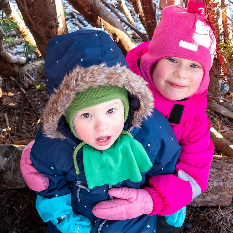 Small children hug. Boy and girl are Caucasians. In winter for a walk.