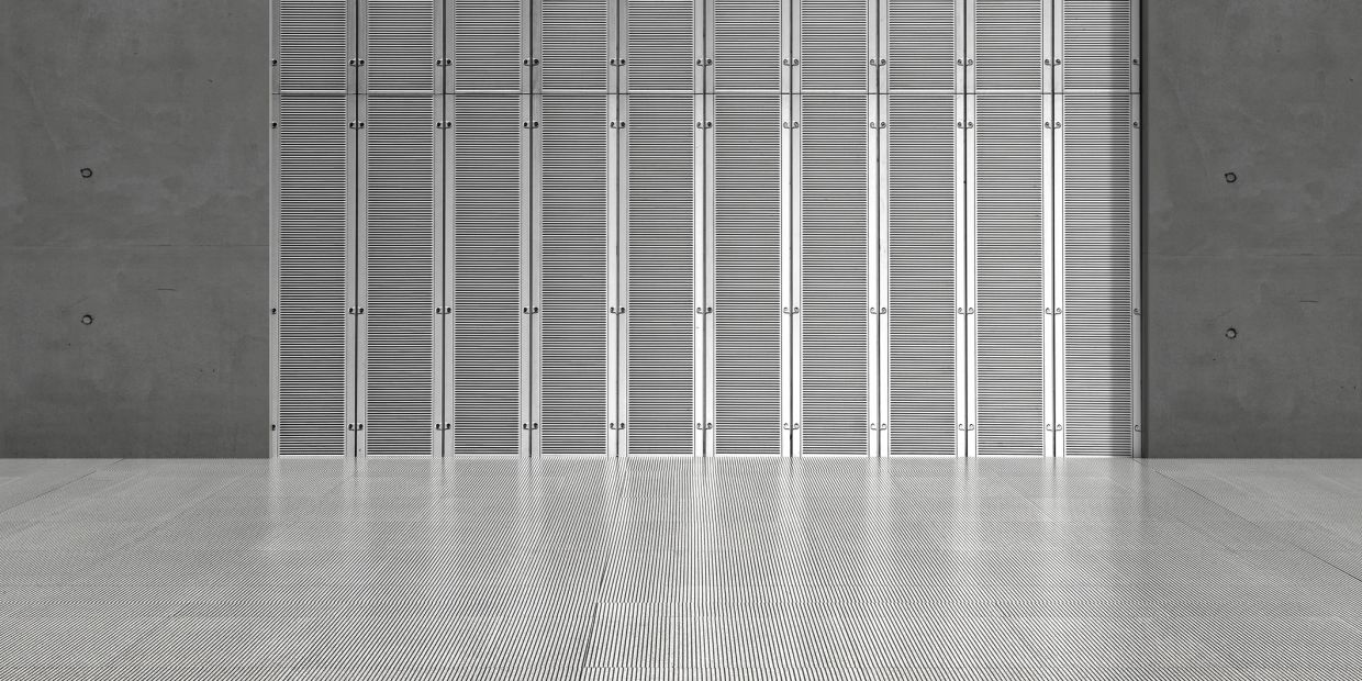 Symmetrical metal panels and concrete walls in a modern space.