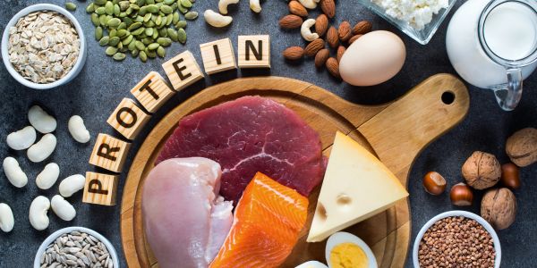 Various protein-rich foods arranged on a surface.