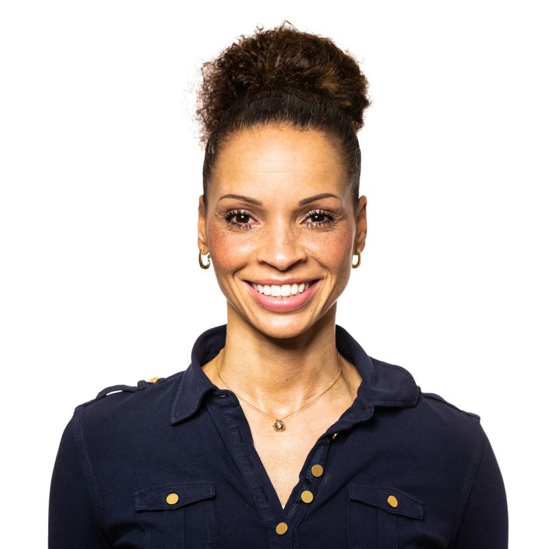 Portrait of a smiling African woman on white background. African American woman looking happy against white background.