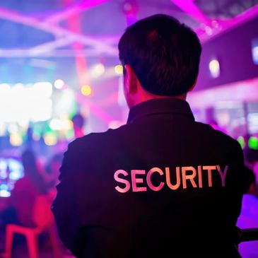 Security guard at a colorful event.