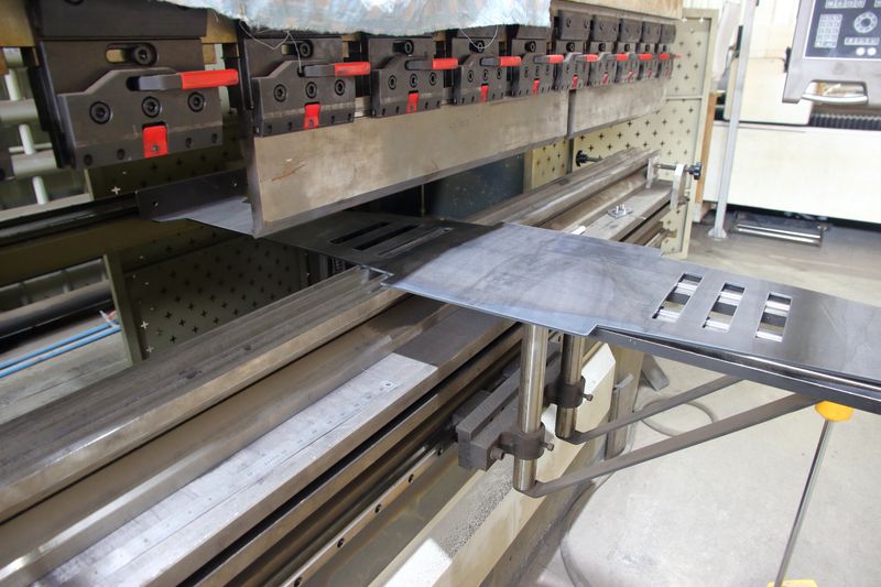 processing of steel product on metal bending machine. High quality photo