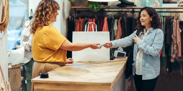 Customer paying at store counter.
