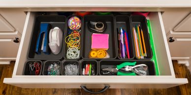 Neatly organized office drawer with various supplies.