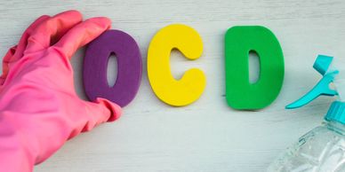 Person repeatedly washing hands, organising items compulsively, illustrating OCD symptoms