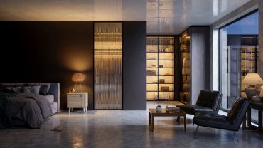 Modern bedroom with dark walls and stylish seating area.