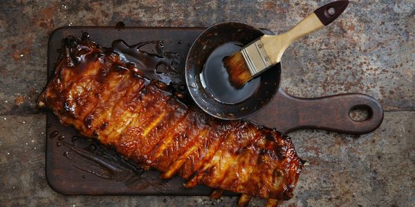 Assorted BBQ platters featuring ribs, brisket, and pulled pork.