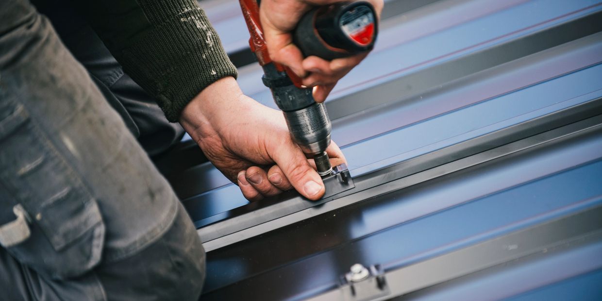 Professional roofer using quality roofing materials photo