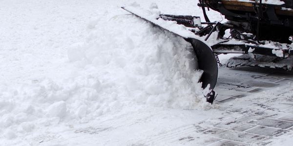 Plow Truck clearing snow from a Big Bear Lake driveway — reliable local snow removal.