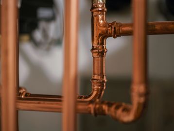 Close-up of copper plumbing pipes.