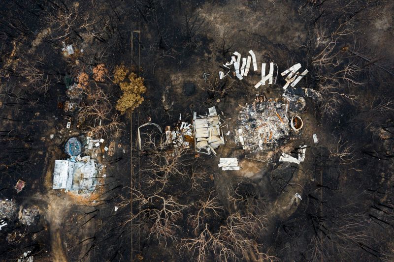 Aerial view of Australian bush fire destruction with a burnt home & property. Bell NSW 2020 bush fires - Blue Mountains