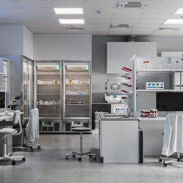 Modern laboratory with equipment and refrigerated storage.