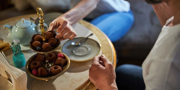 Two people sharing desserts at a cozy table.