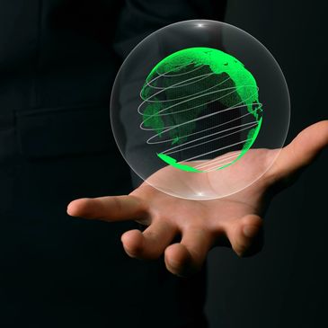 This is an image of an out stretched hand with a globe of the earth in the palm of the hand.