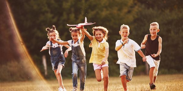 Kids playing and dreaming about learning how to fly an airplane