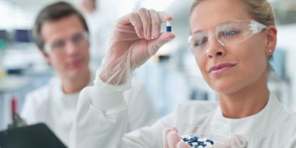 Scientists analyzing brain scans in a modern laboratory.