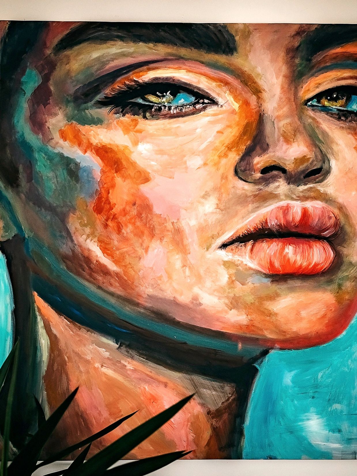 Abstract portrait painting of a woman's face with vivid colors.