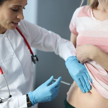 Regestered Nurse administering a GLP-1 injection for weight loss management