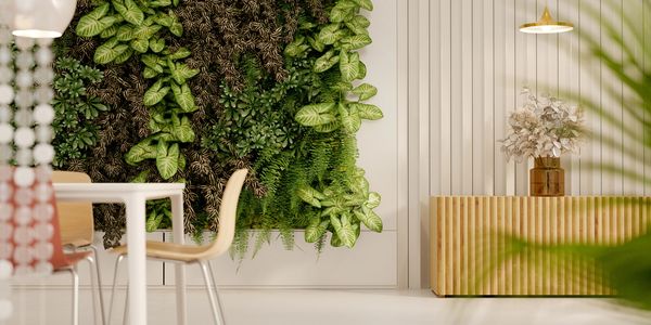 image of a nice looking white kitchen and table with lots of real plants. 