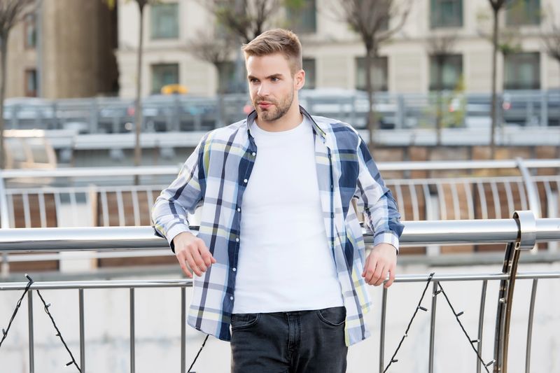 Affordable fashion for every day. Sexy man lean on railing urban outdoors. Casual wear and clothing. Summer fashion. Fashion trends. Stylish menswear. Streetwear. You are the star of street style.