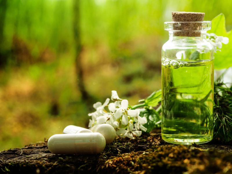 Organic bio alternative medicine, Herbal medicine., bottles of healthy essential oil or infusion and dry medicinal herbs.