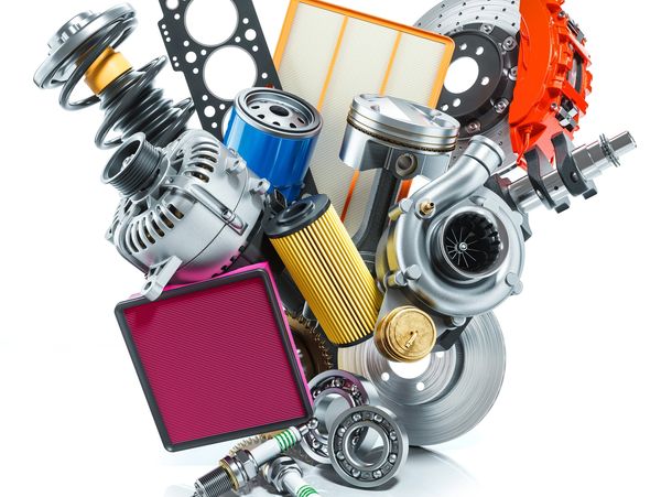 Various automotive parts like filters, piston, and brake disc on white background.