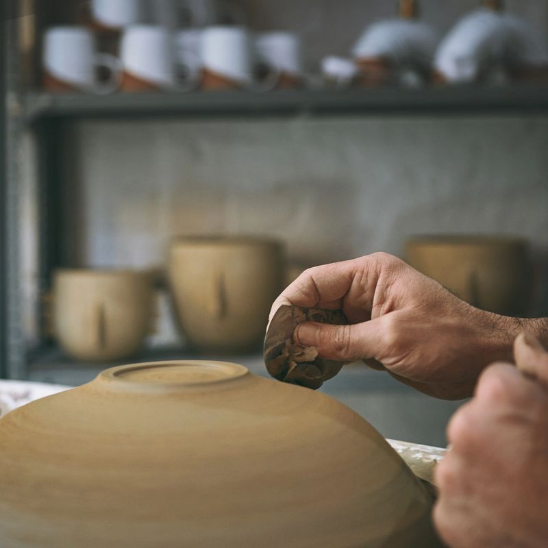 Shot of an unrecognisable man working with clay in a pottery studio