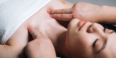 Person receiving a chest massage.