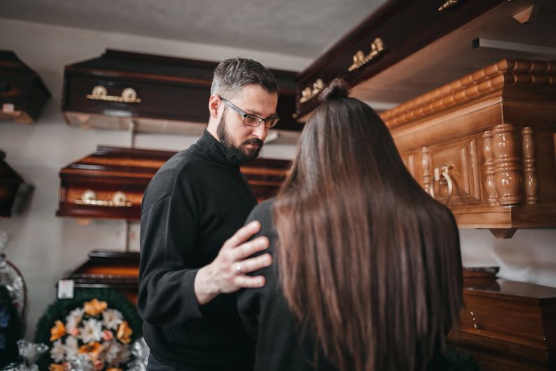 The man comforts the widow