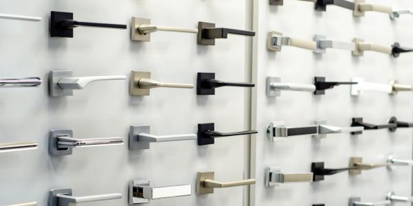 Various door handles on a display wall.
