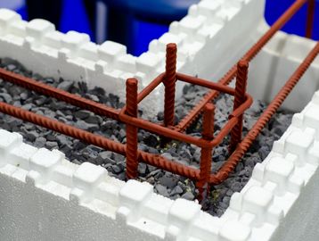 Close-up of construction materials with rebar and styrofoam blocks.