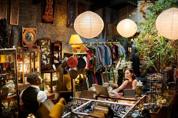 Vintage store with a man and a woman interacting.