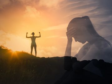 Silhouette of a woman showing strength against a backdrop of a thoughtful, stressed reflection.