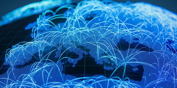 Digital globe with interconnected glowing blue lines representing global network connections.