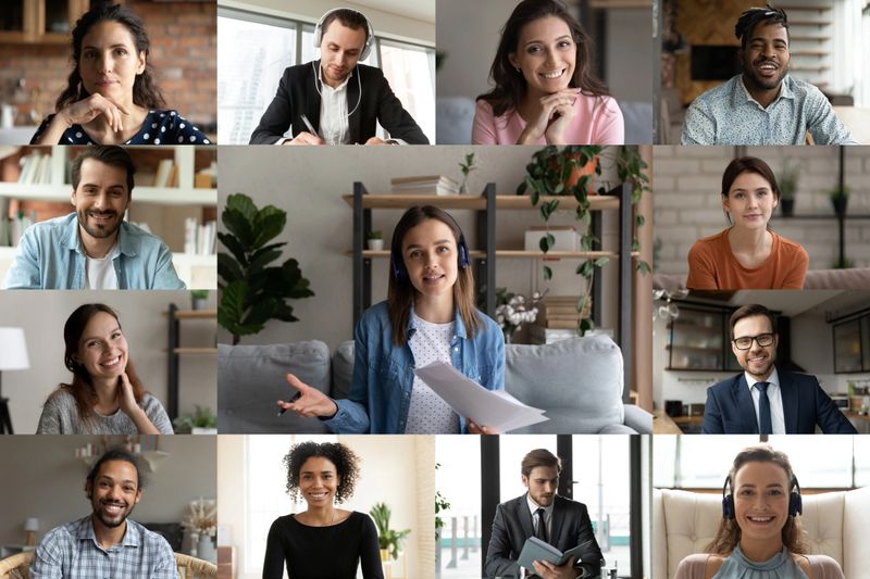 Smiling young caucasian businesswoman involved in video call conference business talk with diverse mixed race colleagues or female trainer giving educational lecture distant event to employees.
