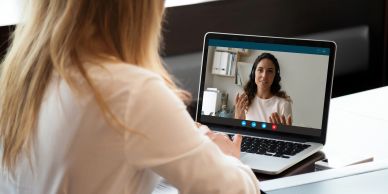 Two women having a video call on a laptop.