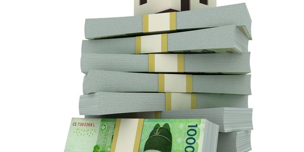 Stacks of 1000 peso bills arranged in a tall pile.