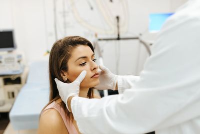 Patient receiving sinus lift treatment from a board-certified periodontist.