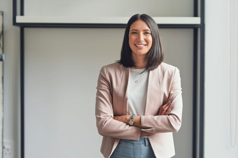 Cropped portrait of an attractive young businesswoman standing alone in her office with her arms folded during the day