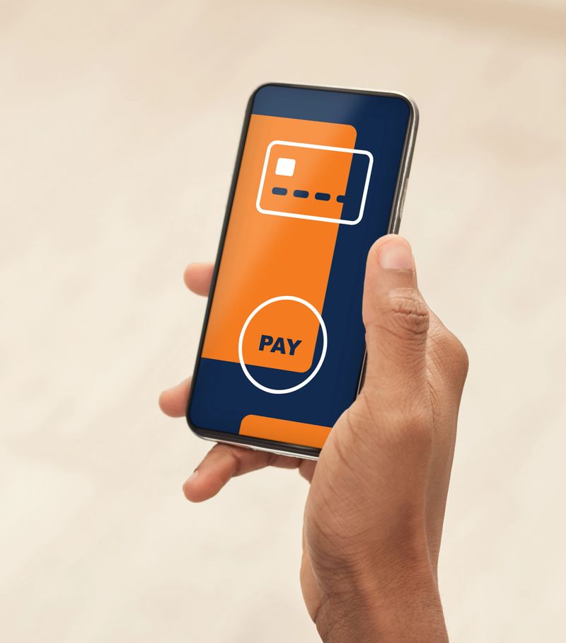 Hand with modern mobile phone with payment procedure screen, unrecognizable black man shopping or banking online, paying for goods and services on Internet, using mobile application