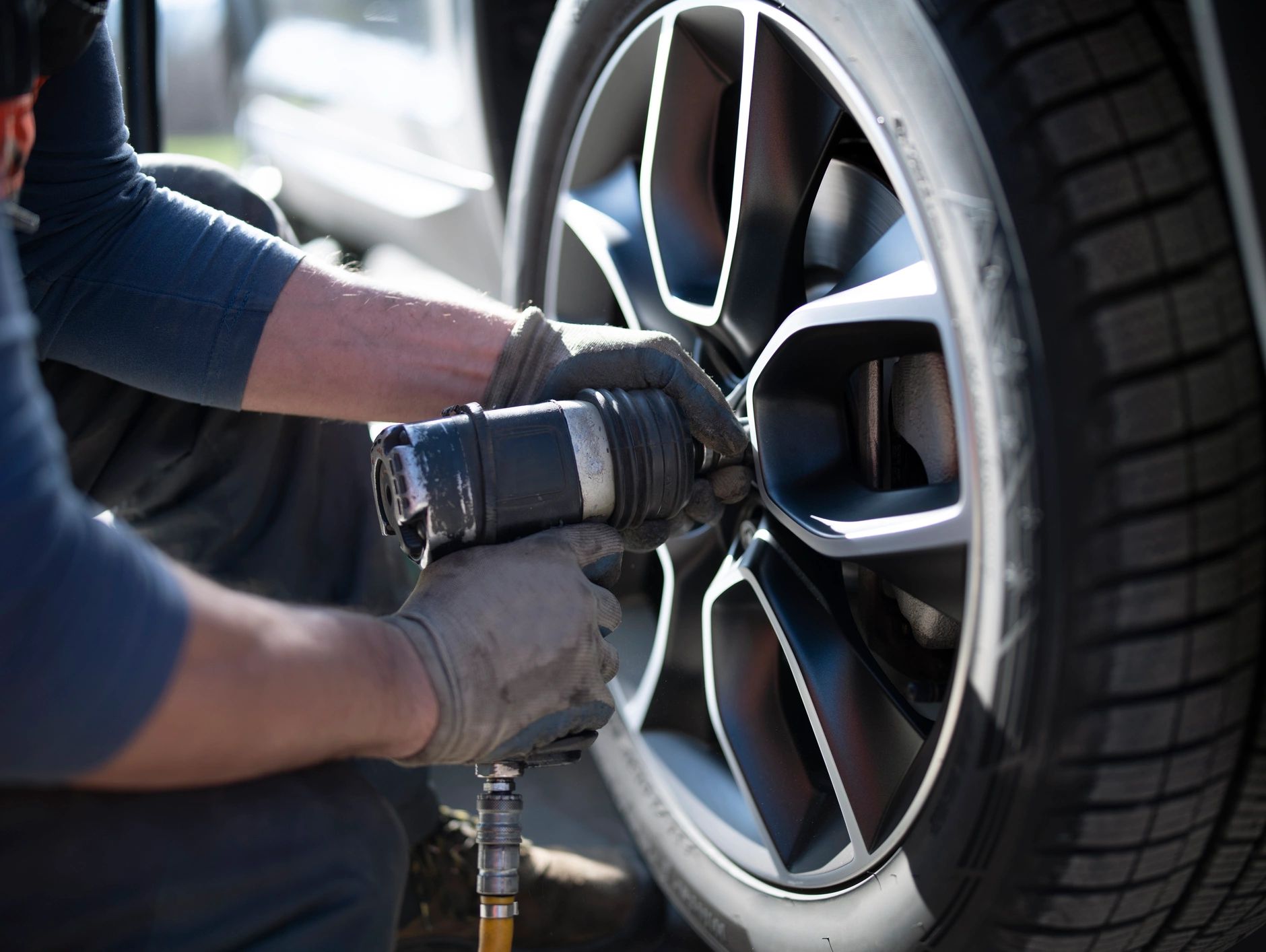 Man repairing car tyre