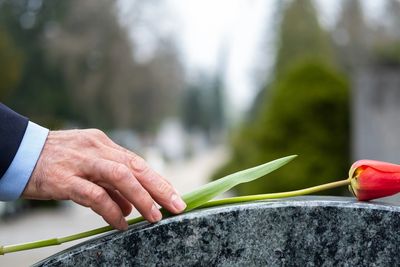 Placement of a rose for their loved one.
