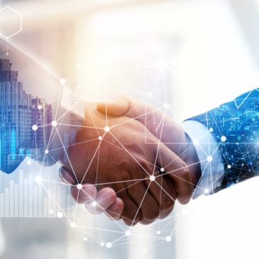 Two people shaking hands with digital network overlay.