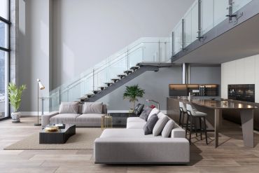 Modern living room with sleek furniture and glass staircase.