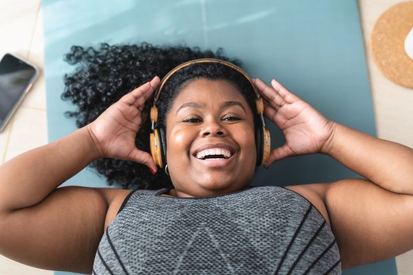 Leap of Faith Fitness | laying down with headphones on 