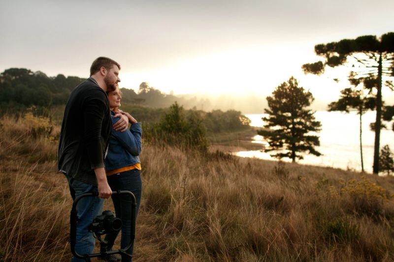Curitiba, Brazil - May 05, 2021: Couple enjoying the afternoon in nature at the sunset in autumn