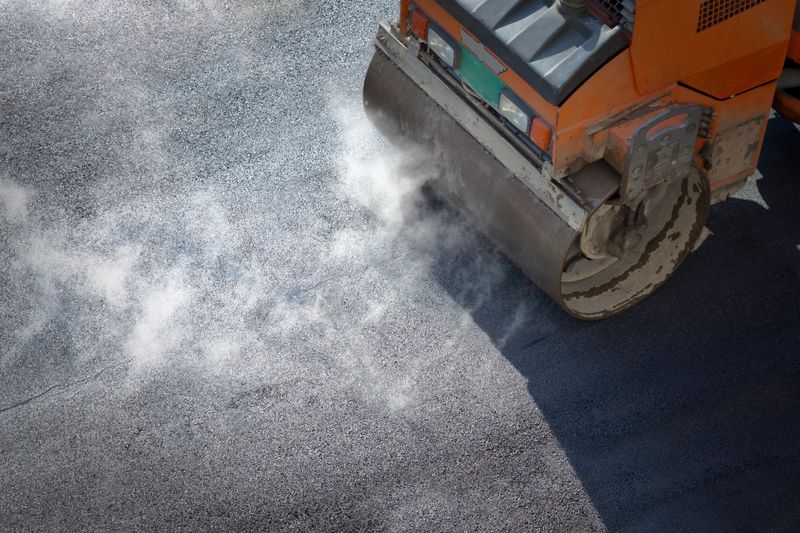 Heavy Vibration roller compactor at asphalt pavement works for road repairing