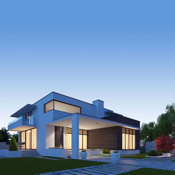 Modern two-story house with large windows glowing warmly at dusk.